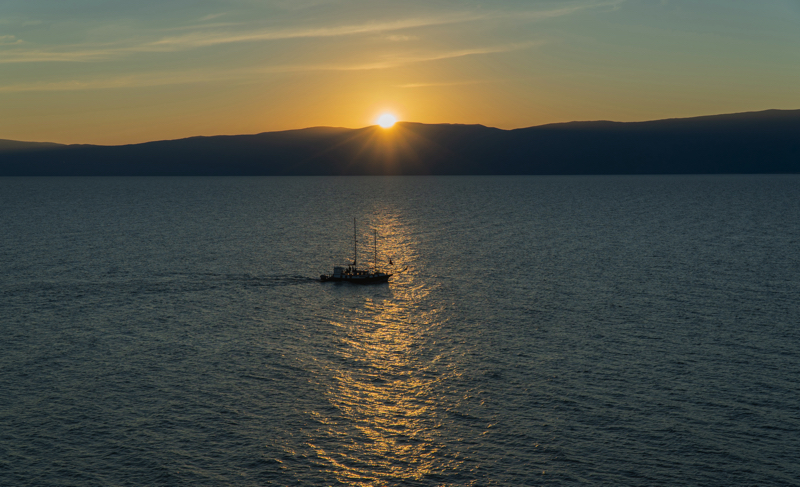 Sunset over the Small Sea, view from Olkhon Island — Lake Baikal tours by Baikal Legends Small Sea strait, view of the Primorsky Ridge — Baikal Legends